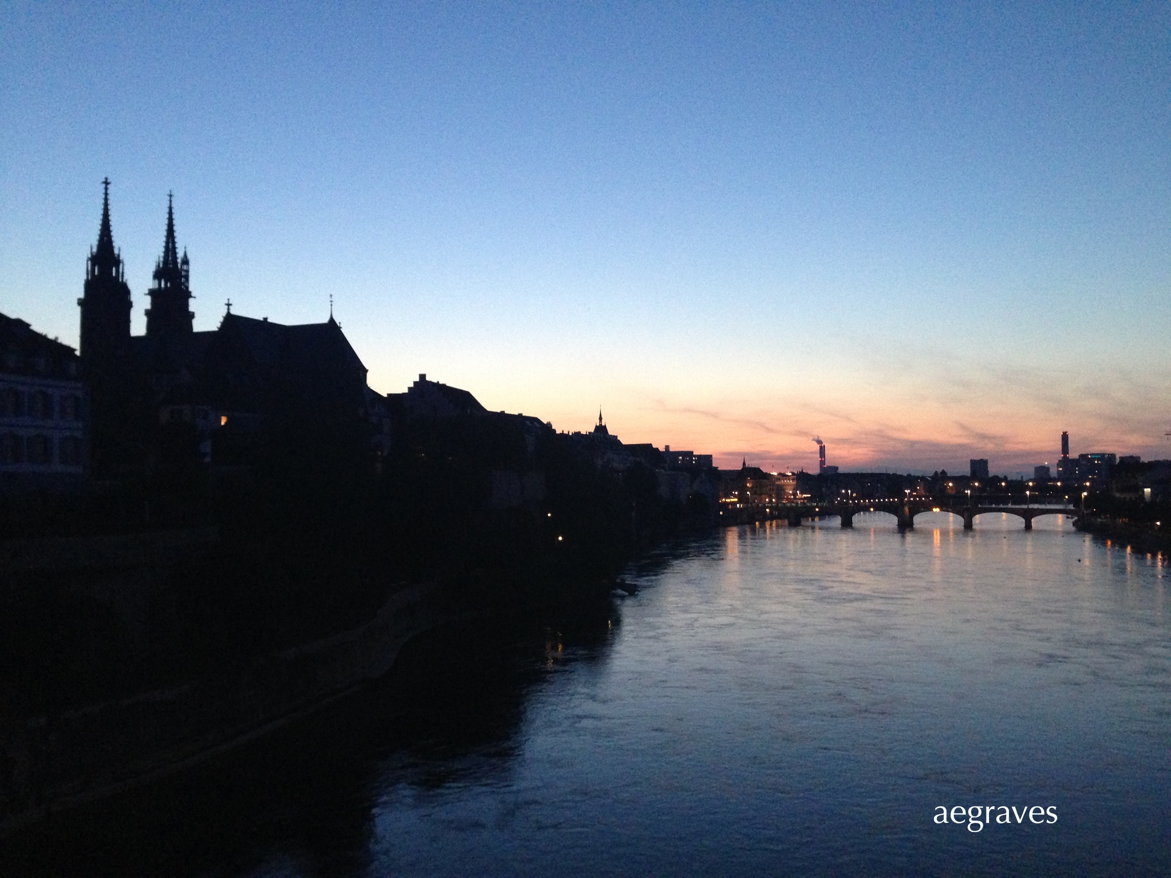 The Rhine reflecting the evening sky in Basel, Switzerland, photograph by A.E. Graves